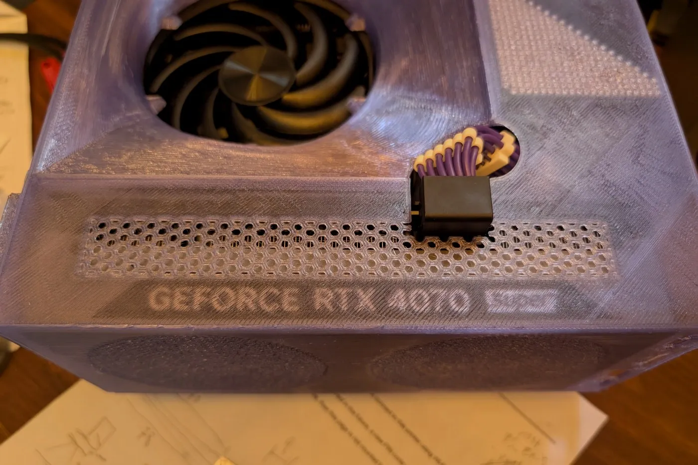A printed vent panel with GEFORCE RTX 4070 embossed into the surface